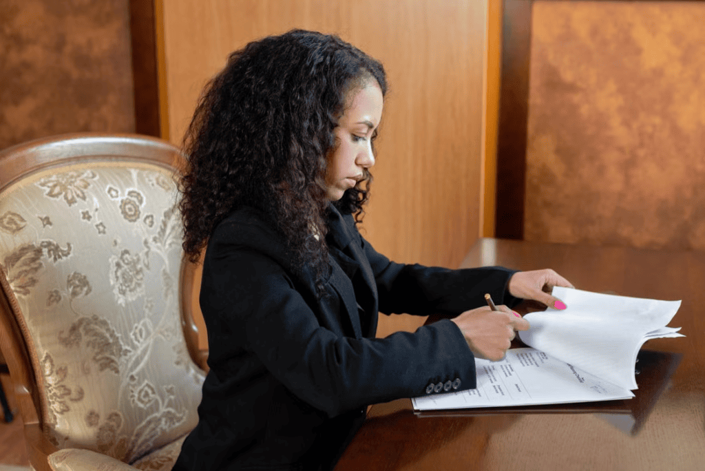 Early-career attorney receiving interview coaching from a legal recruiter.